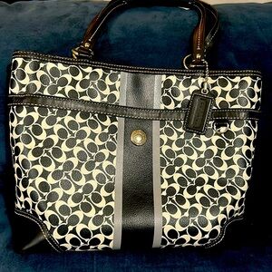 Coach Purse w/ zip top closure & exterior pockets.